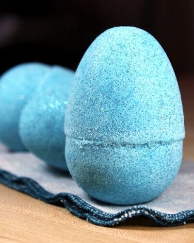 The perfect non-candy Easter basket fillers, these DIY Easter egg bath bombs add fun bubbles, color and sparkling glitter to your bath time experience.