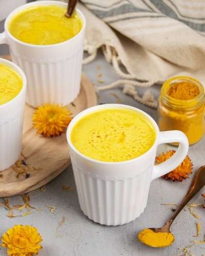 Learn how to make a healthy golden milk latte recipe. Discover golden milk latte benefits to boost immunity for natural health and wellness.