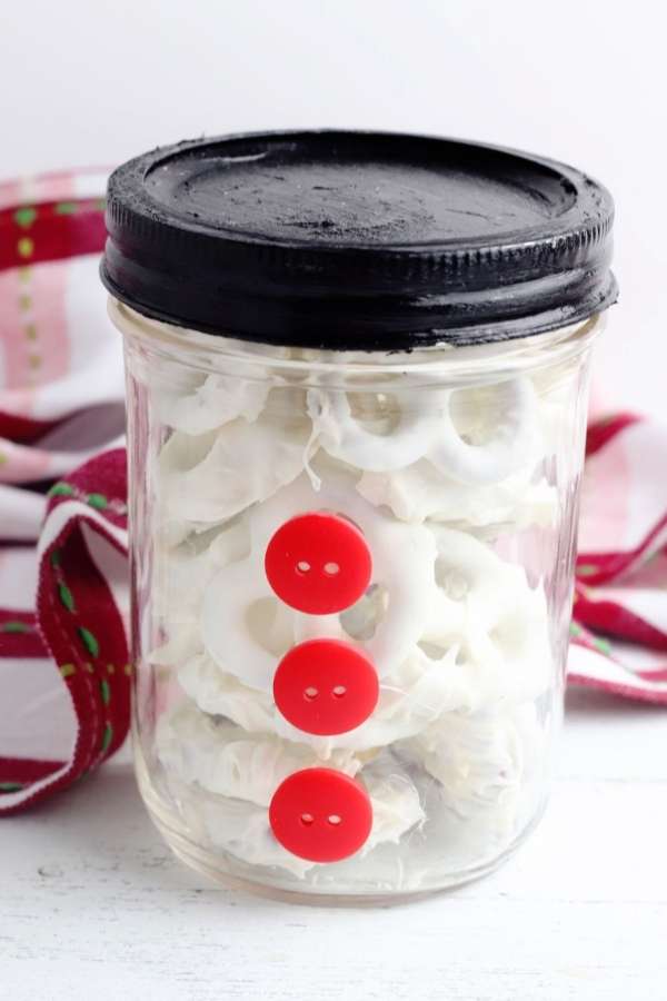 glue red buttons on mason jar for diy snowman mason jar food gift