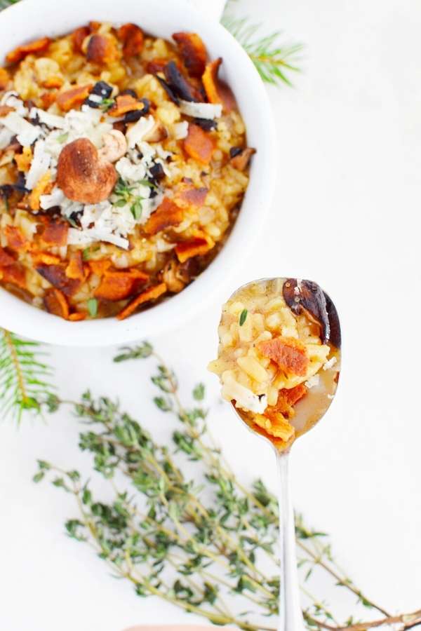 Make this creamy mushroom bacon risotto recipe with cheese as a delicious family dinner idea for winter. This easy risotto recipe is perfect for weeknight dinners with family or a weekend dinner with friends. A warming winter dinner idea, this mushroom risotto can also be made without the bacon or with a bacon substitution for a vegetarian alternative. This kid-friendly mushroom bacon risotto recipe is accented with the flavor of grated parmesan and fresh thyme everyone in your family will love.