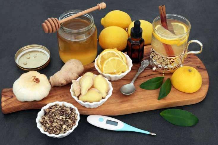 Cold and flu remedies. How to make natural remedies for colds and flu including a hot tea cold remedy drink, fire cider vinegar, immune boosting golden milk latte, elderberry syrup, elderberry tincture with herbs for cold and flu relief, and custom herbal tea blends for colds.