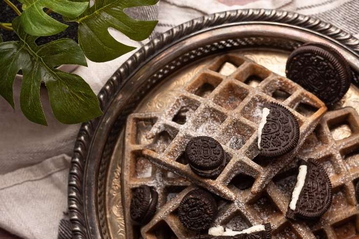 How to make chocolate dessert waffles with pancake mix or from scratch. Make this delicious Oreo waffles recipe either with a waffle iron or in a grill pan if you don't have a waffle maker. Both kids and adults will love this twist on a classic breakfast waffle recipe. This breakfast and brunch idea is kid-approved and a family favorite. Tips for making homemade waffles, waffle topping ideas and how to freeze this special occasion breakfast idea.