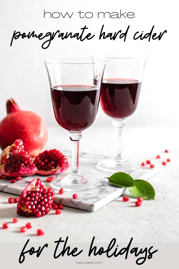 Alcoholic mulled cider recipe. How to make a hard pomegranate cider cocktail as a warm alcoholic winter drink. This spiked mulled cider recipe is one of my favorite pomegranate recipes for winter drinks. An easy apple cider pomegranate drink, this mulled cider recipe can be made on the stovetop or crockpot. Perfect for holiday parties, party guests will love the flavor combination of pomegranate, apple cider and warm spices that give this pomegranate cider a unique and complex flavor.