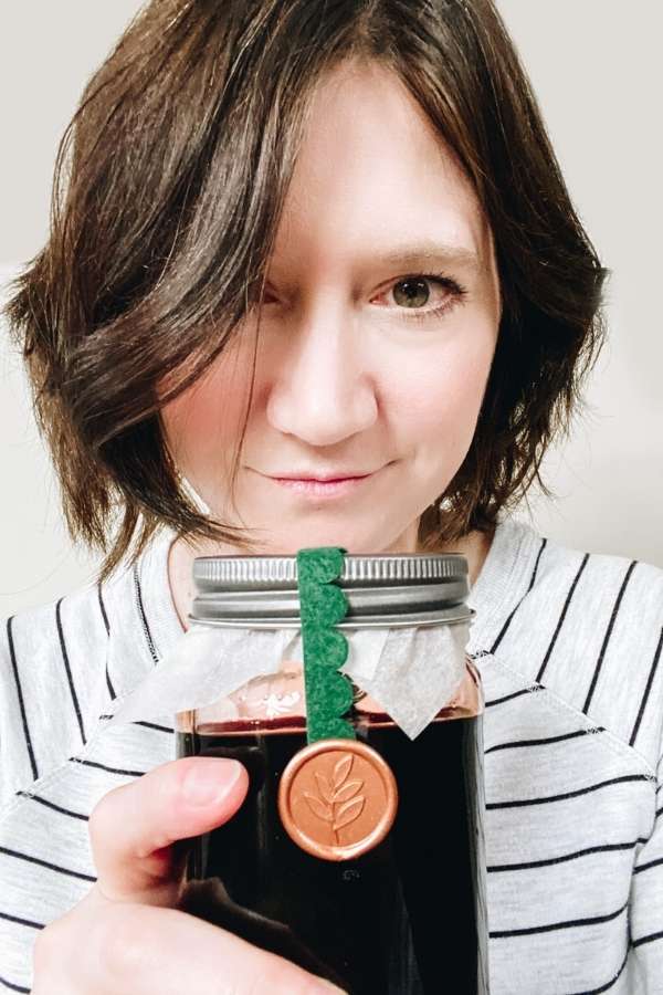 Learn how to make an elderberry tincture recipe with herbs as an immunity boosting cold and flu elixir. Discover the benefits of an elderberry immunity elixir and how it can support immune health. Plus other herbs that offer immune support and can be used in an elderberry immunity cold and flu tincture to create a natural cold and flu remedy. Learn the difference between elderberry syrup vs tincture, dosage for elderberry tincture, how to store an elderberry tincture and precautions.