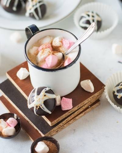 Make this mini hot chocolate bomb recipe as a warm winter drink to enjoy on cold, snowy days. Plus tips and tricks for the perfect outcome.