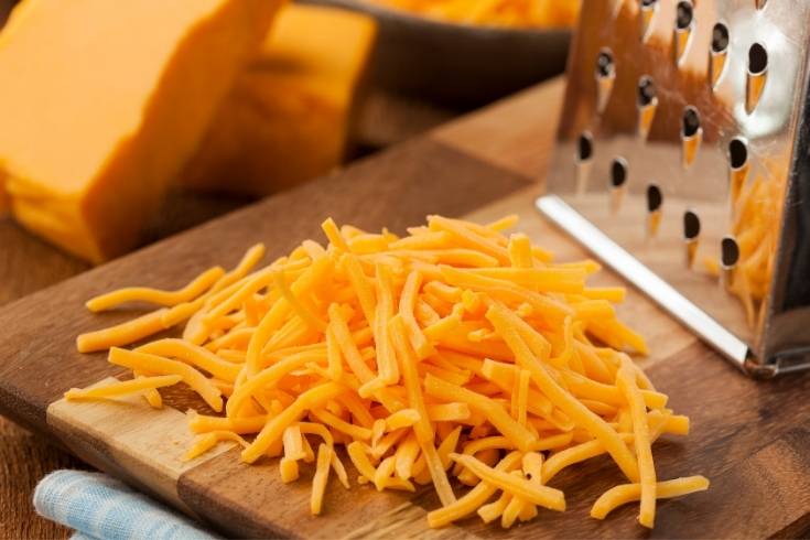 shredded sharp cheddar cheese for improved flavor in apple bread