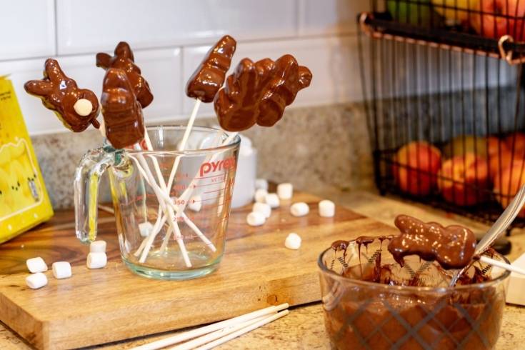 chocolate dipped marshmallows cooling in glass jar