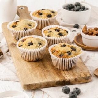 no sugar almond flour blueberry muffins on cutting board