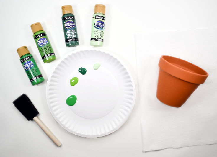 prepare green paint to make painted terracotta pots