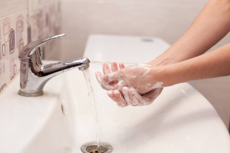 washing hands with antibacterial soap