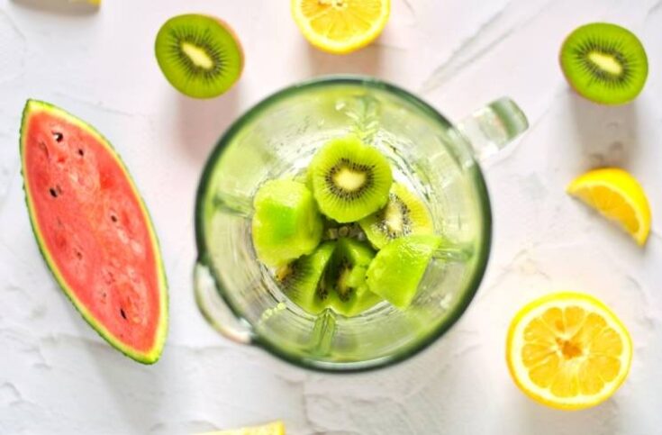Cut kiwi in blender for making watermelon kiwi popsicles