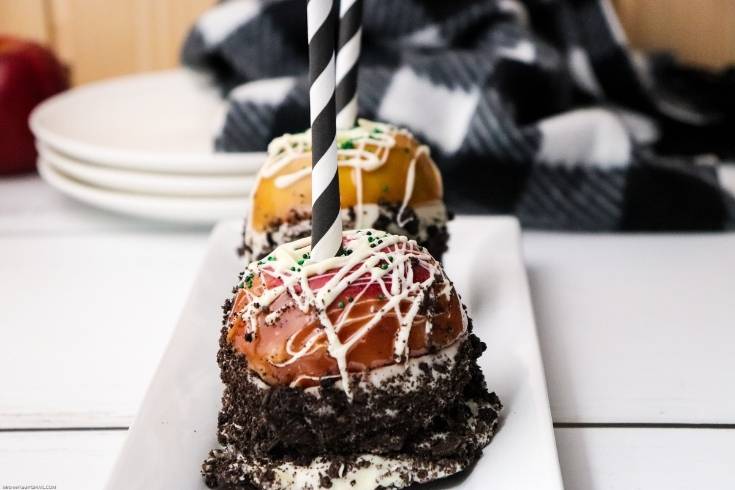 easy caramel apples with decorative paper straws hiding the candy apple sticks