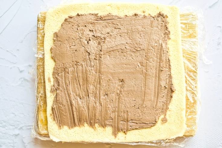 fill classic christmas yule log cake with chocolate ganache