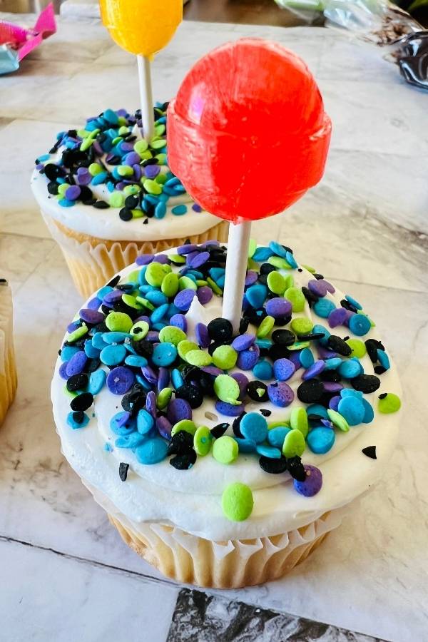 place dum dums lollipop inside cupcakes