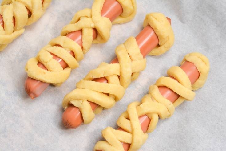wrap hot dogs with crescent roll dough strips